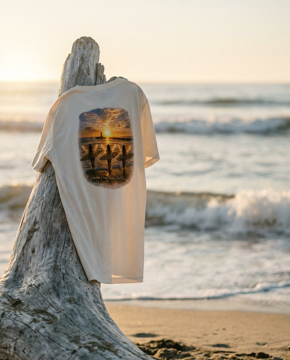 Relaxed Tee back print on driftwood at golden hour beach